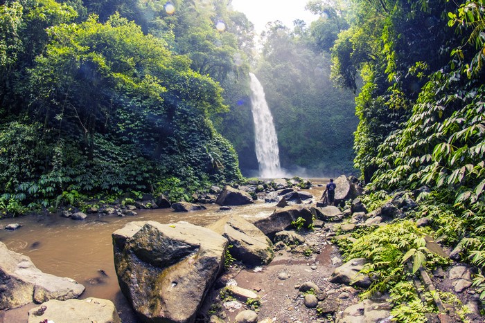 Waterfall in Bali, Indonesia with a person