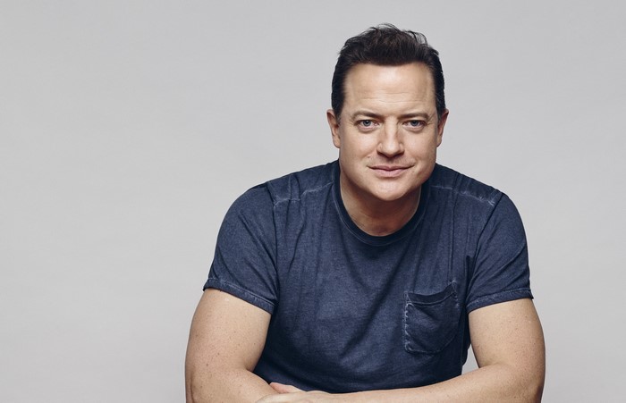 Brendan Fraser on a gray background