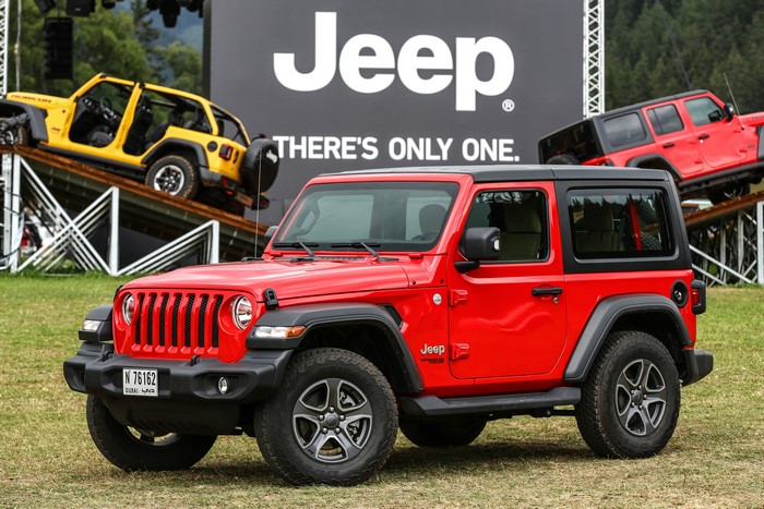 Red Jeep Wrangler with Jeep branding