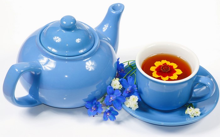 Blue teapot and teacup with flowers