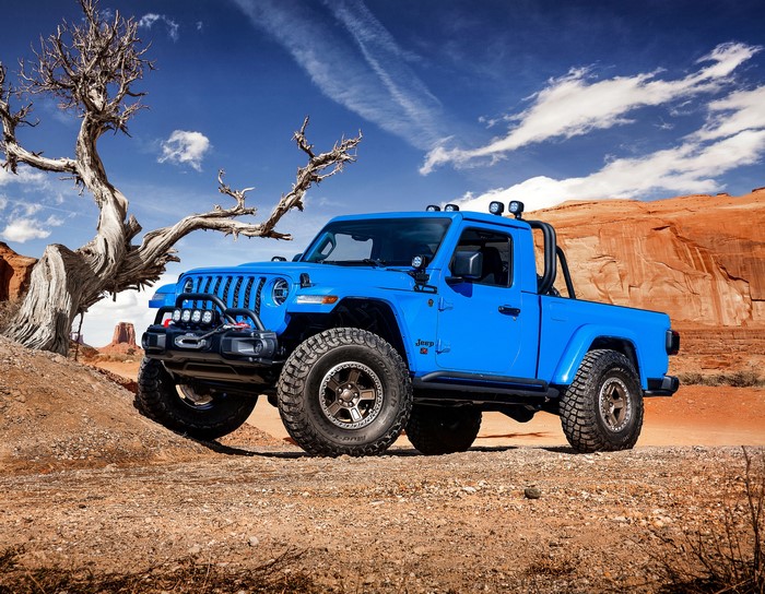 Blue Jeep Gladiator Pickup Truck in Desert Landscape