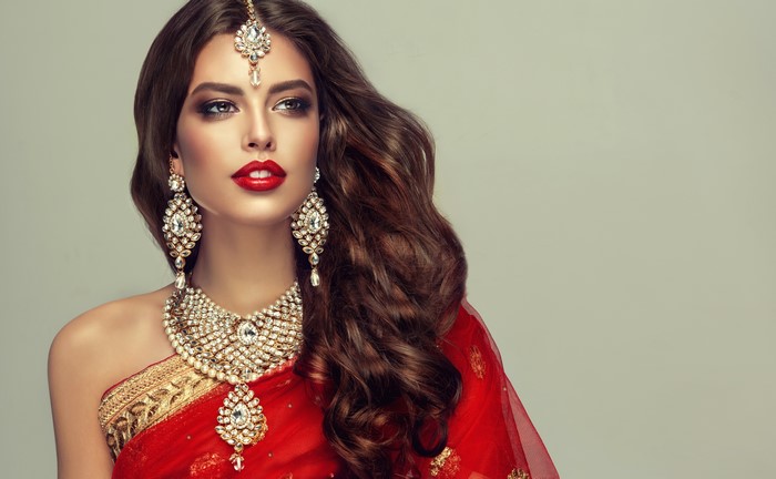Elegant Woman in Red Saree with Jewelry 4K