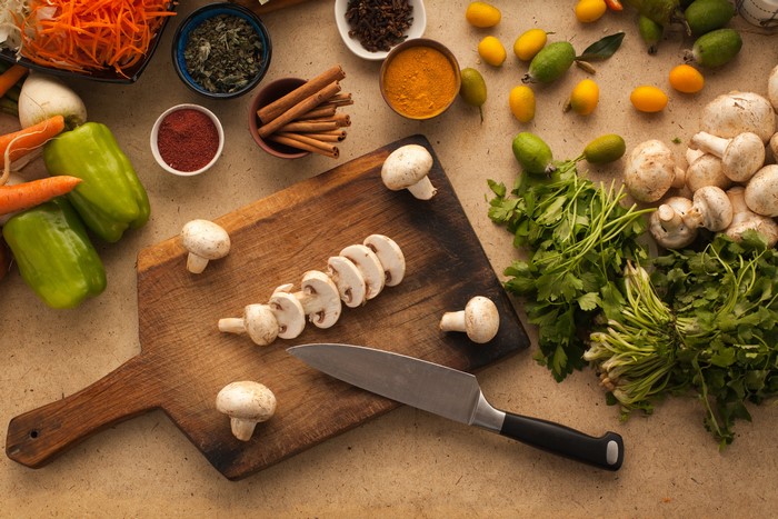 Mushrooms, Spices, and Vegetables on a Cutting Board