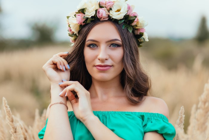 Woman with Flower Wreath in Field
