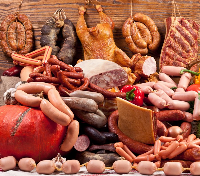 Assortment of Meat Products, Sausages, and Roast Chicken