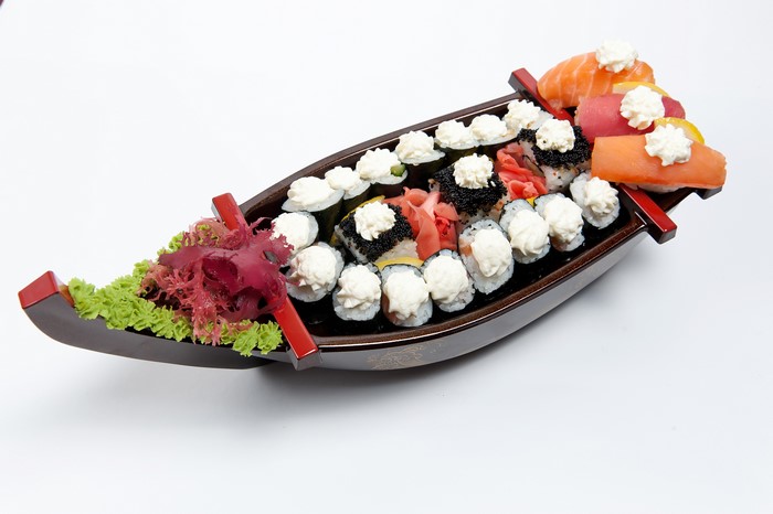 Sushi boat with seafood and vegetables