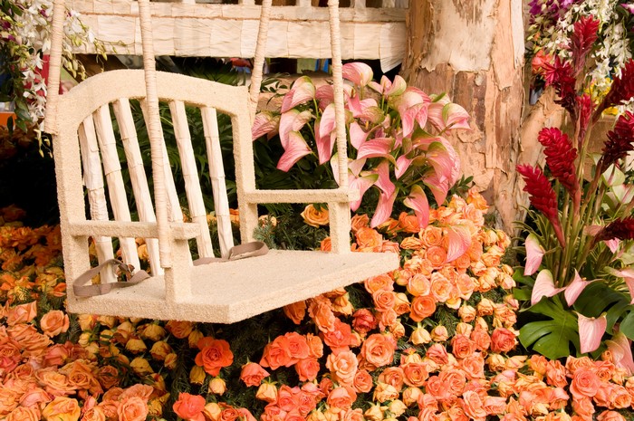 Floral swing decorated with roses and calla lilies