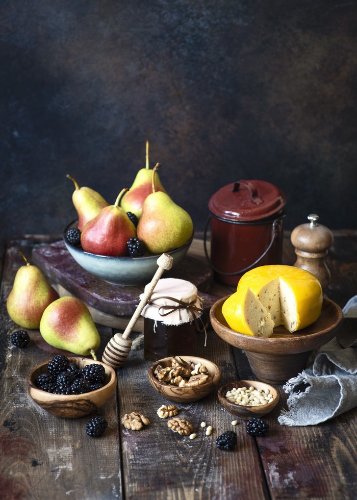 Cheese, Pears, Nuts, Blackberry, and Jam on Wood