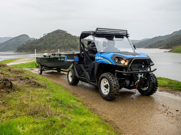 New Holland Rustler 850 UTV towing a boat