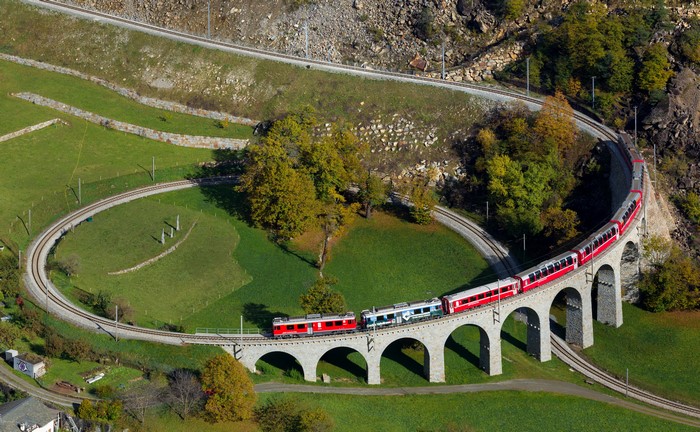 Brusio spiral viaduct with trains in Switzerland