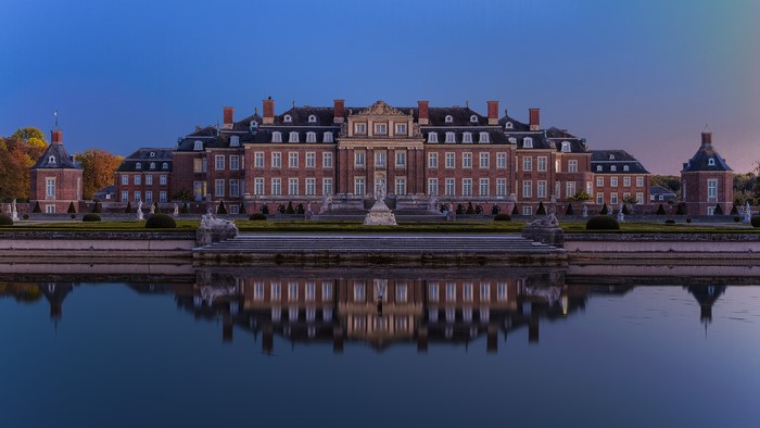 Palace of Nordkirchen reflected in a pond at dusk