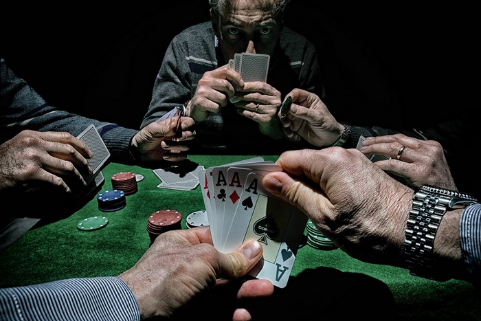 Poker game with four Aces