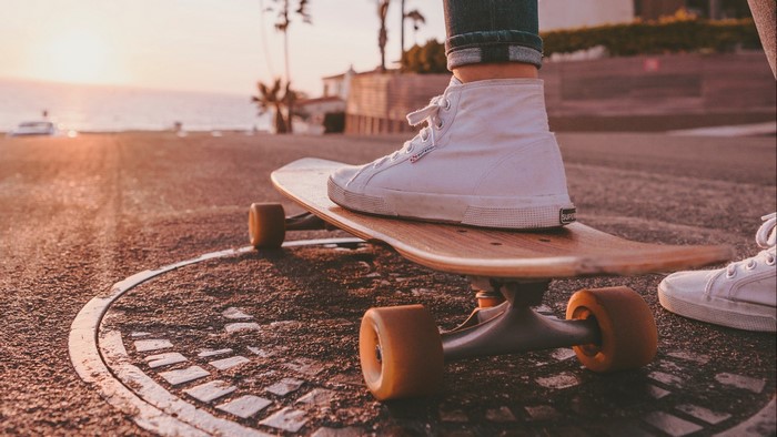 Person on skateboard at sunset