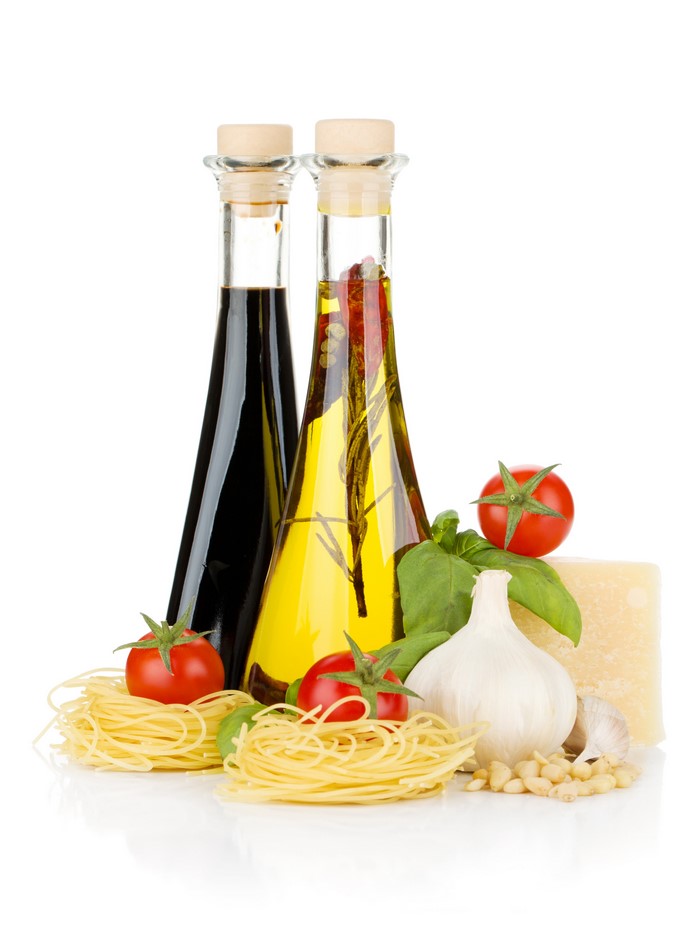 Balsamic Vinegar and Olive Oil Bottles with Pasta and Ingredients