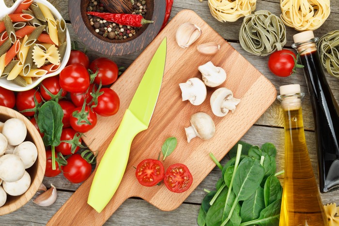 Ingredients for Pasta Dish: Tomatoes, Mushrooms, Pasta, and Spices