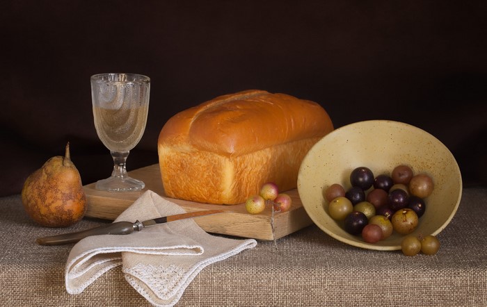 Still-life with bread, wine, grapes, and pears