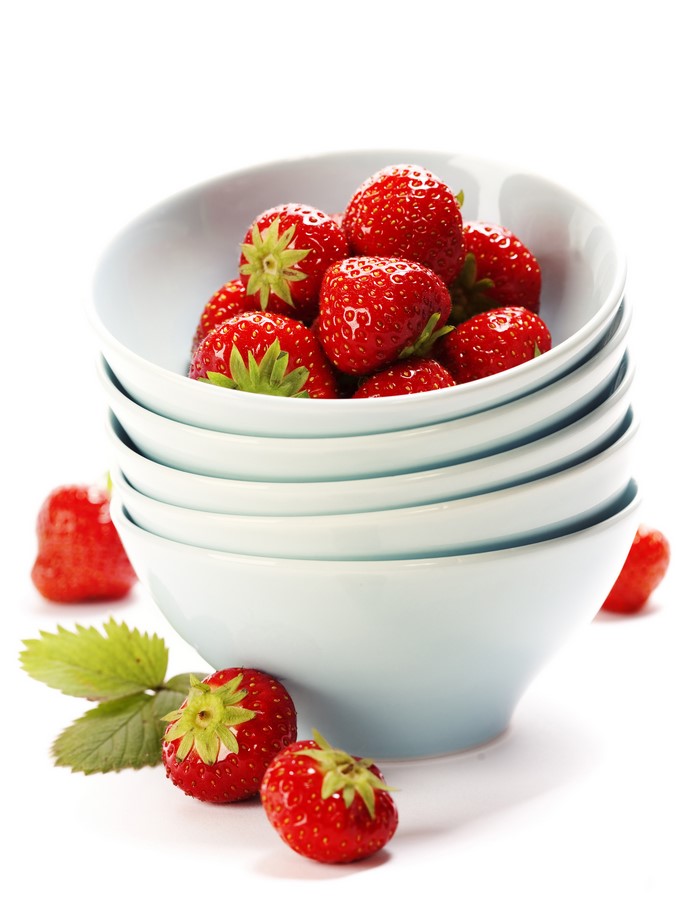 Strawberries in a stack of bowls