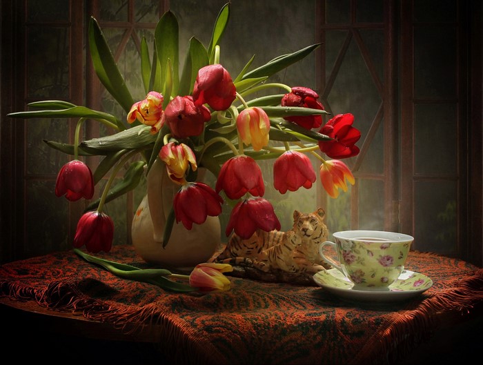 Still-life with tulips, tiger figurine, and tea cup