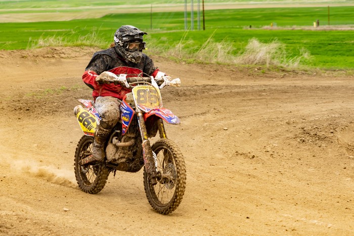 Motocross rider on a muddy track