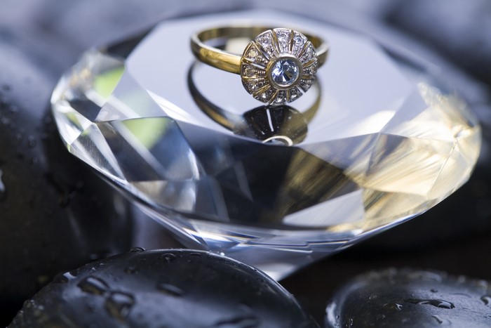 Gold ring with diamonds on a crystal