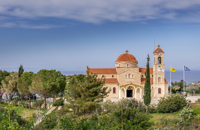 Agios Raphael Church Pachyammos Cyprus with flags