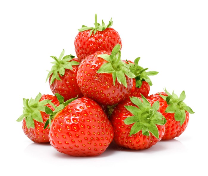 Pile of fresh strawberries on a white background