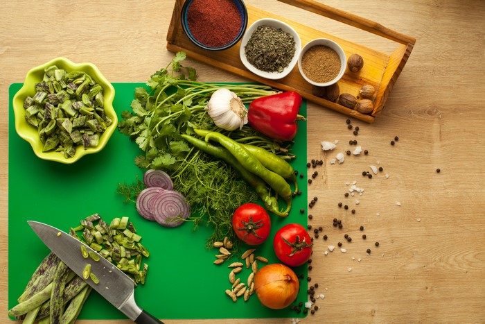 Vegetables and spices on a wooden table