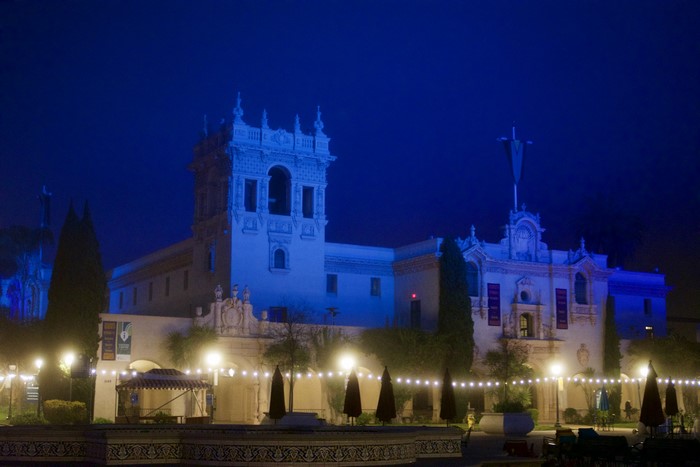 Balboa Park building at night with blue lighting