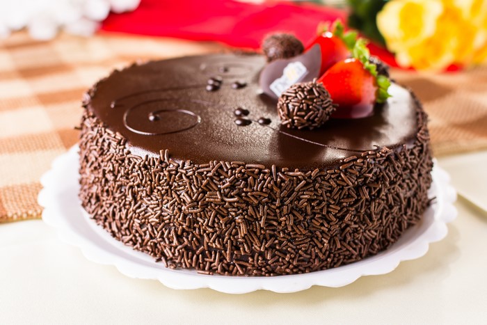 Chocolate cake with sprinkles and strawberries