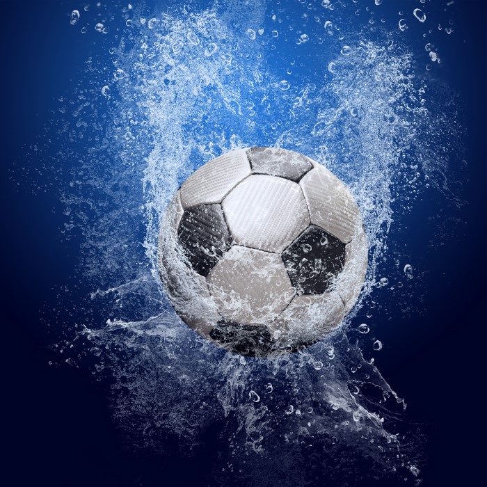 Soccer ball in a water splash