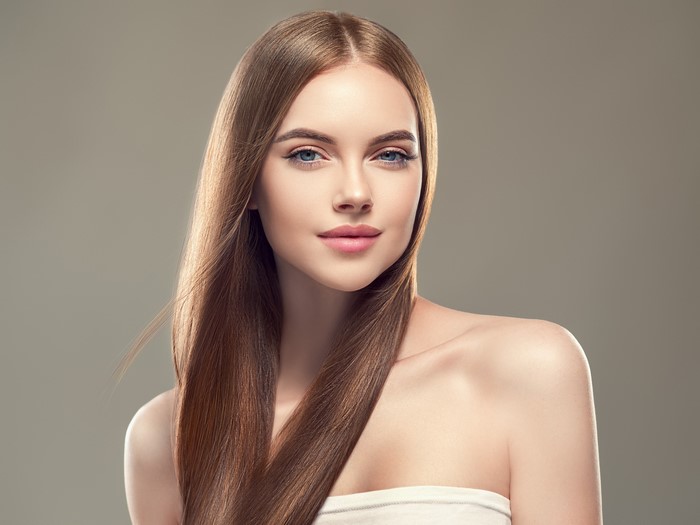 Elegant Young Woman with Long Brown Hair