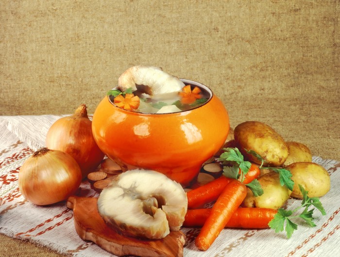 Still-life with soup, vegetables, and fish
