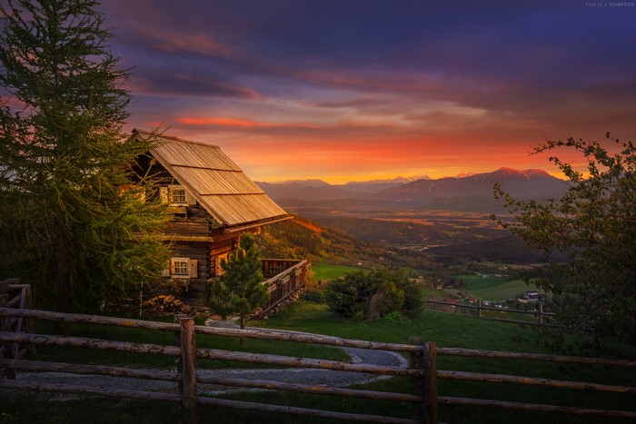 Wooden house on a hill at sunset in Magdalensberg, Austria