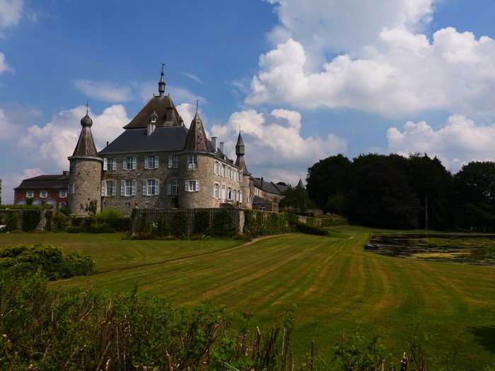 Hodoumont Castle in Belgium with a manicured lawn