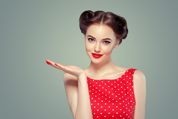 Woman with retro hairstyle and red polka dot dress