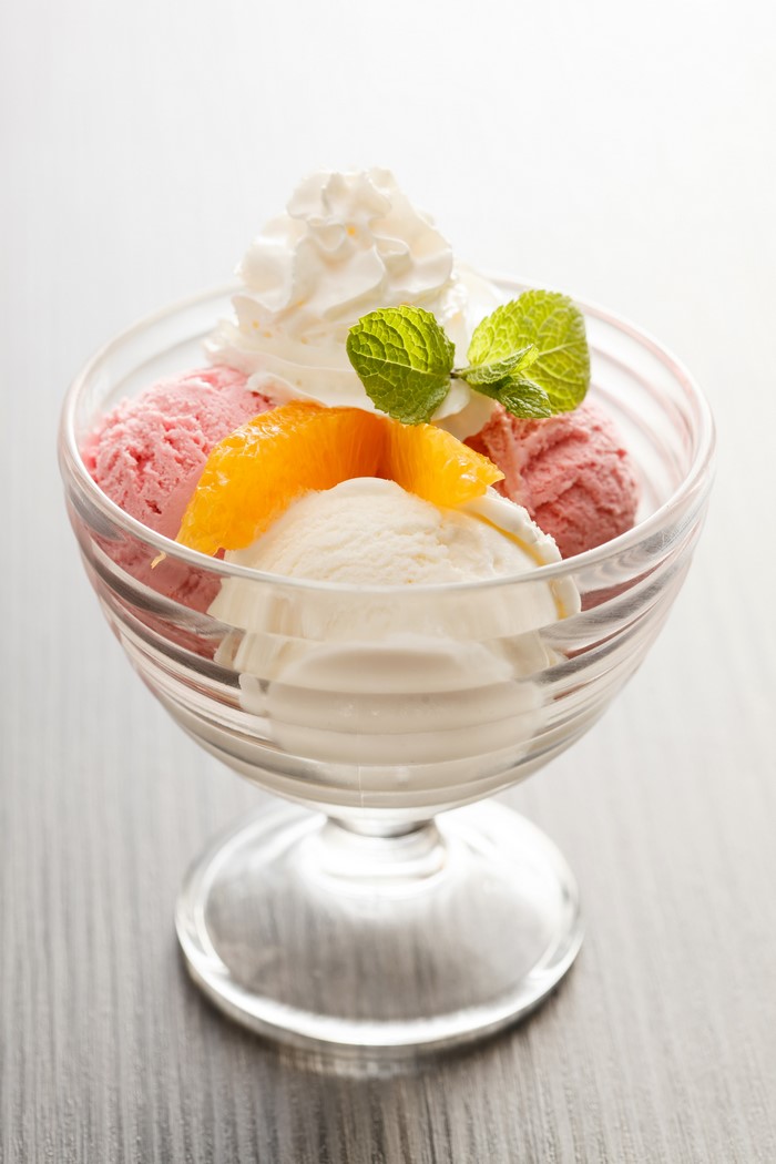 Ice cream sundae with whipped cream and fruit
