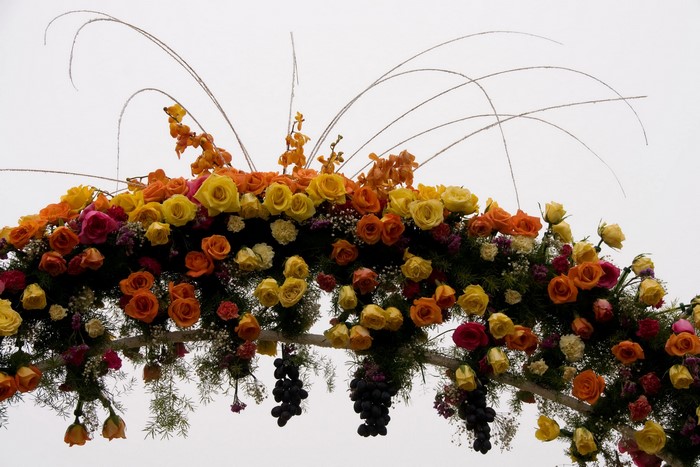Archway decorated with roses and grapes