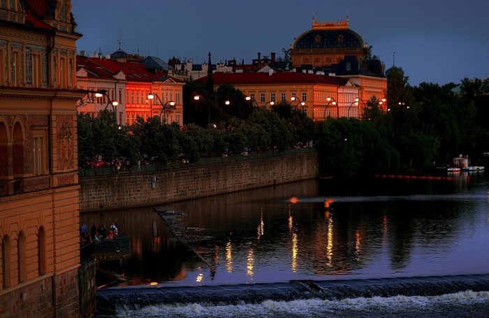 Prague buildings and river at dusk