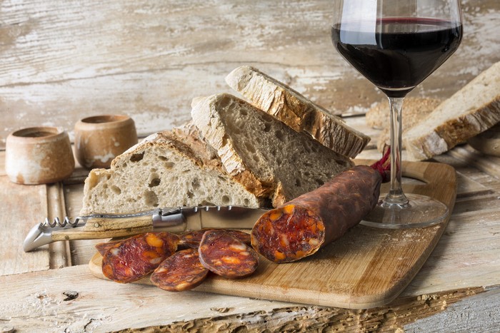 Sausage, Bread, and Red Wine on Wood