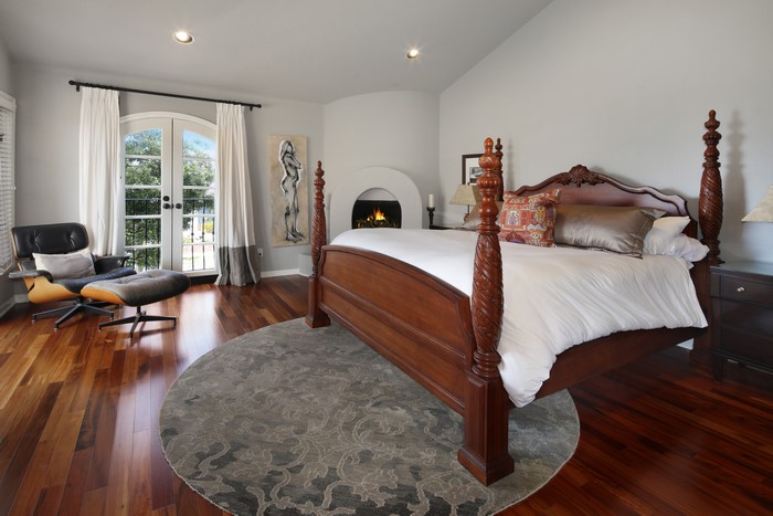 Bedroom with Four-Poster Bed and Armchair