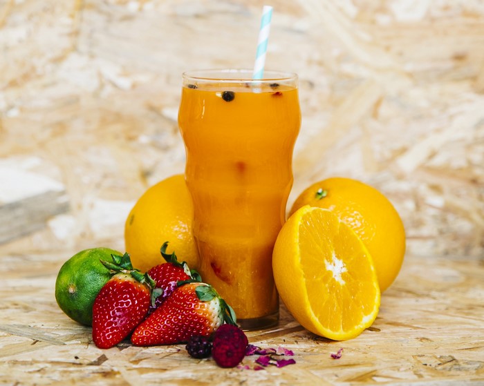 Orange juice with fruits in a glass