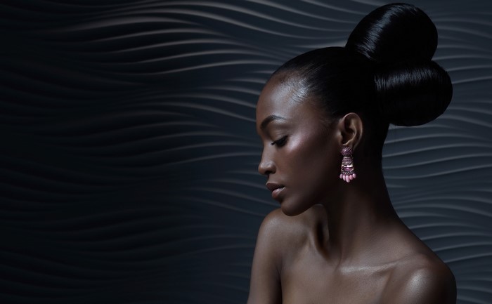 Brunette girl with earrings and elaborate hairstyle
