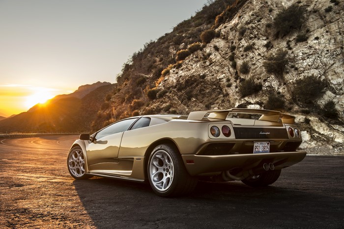 Gold Lamborghini Diablo back view at sunset