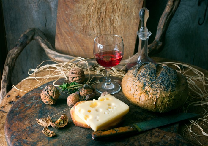 Still-life with bread, cheese, wine, nuts, and knife