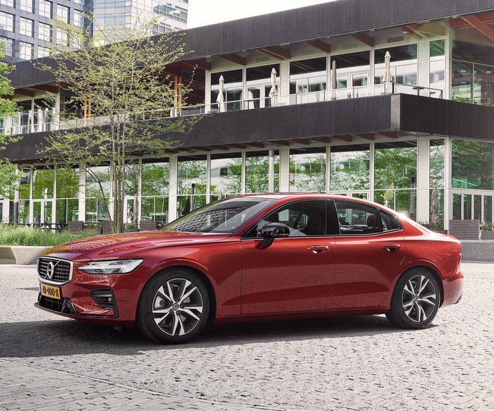 Red Volvo S60 T5 R-Design parked outside a modern building