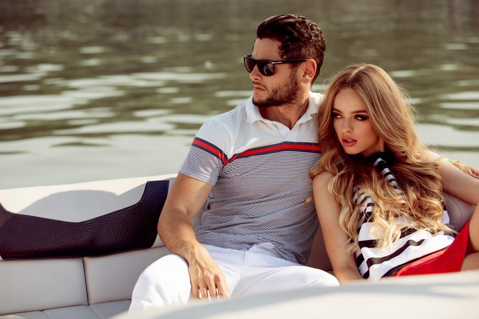 Couple on a boat wearing sunglasses