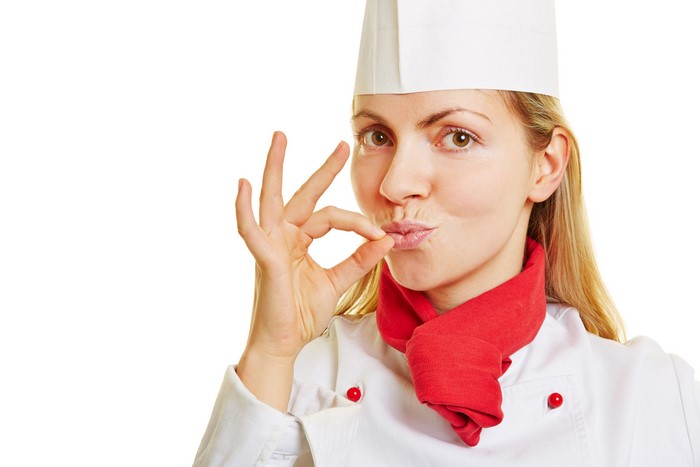 Chef tasting food with fingers