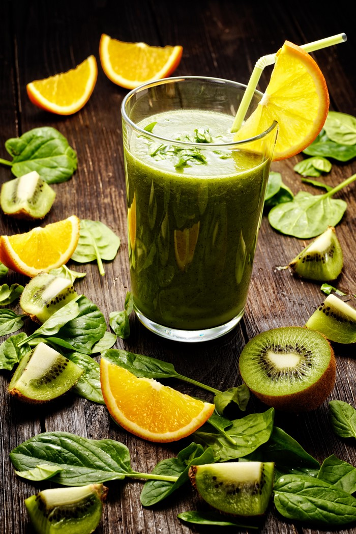 Green smoothie with kiwi, orange, and spinach