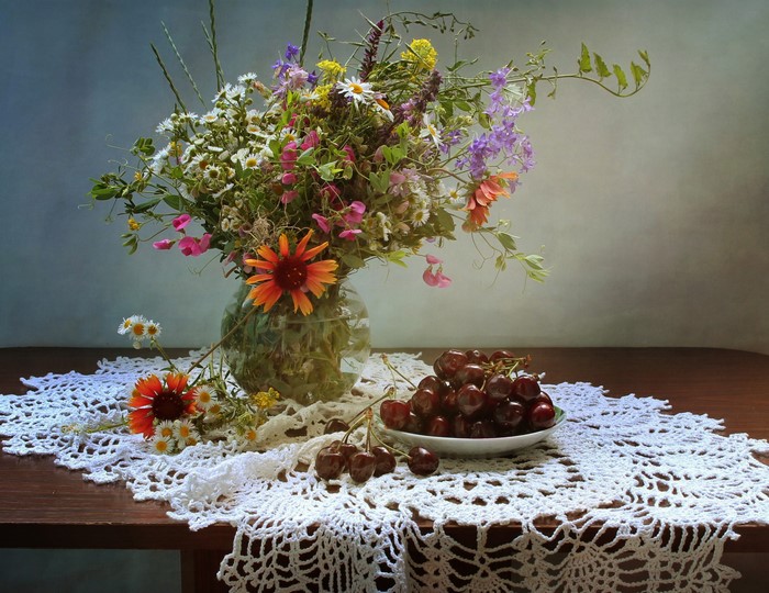 Still-life with wildflowers and cherries