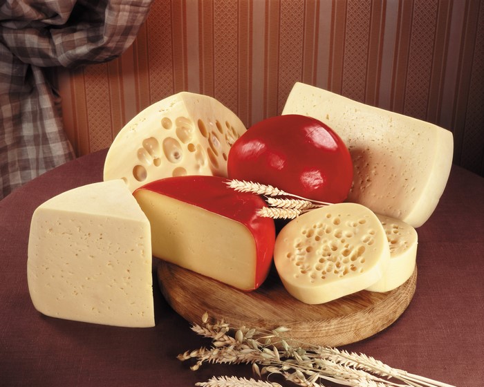 Assortment of cheeses on a cutting board
